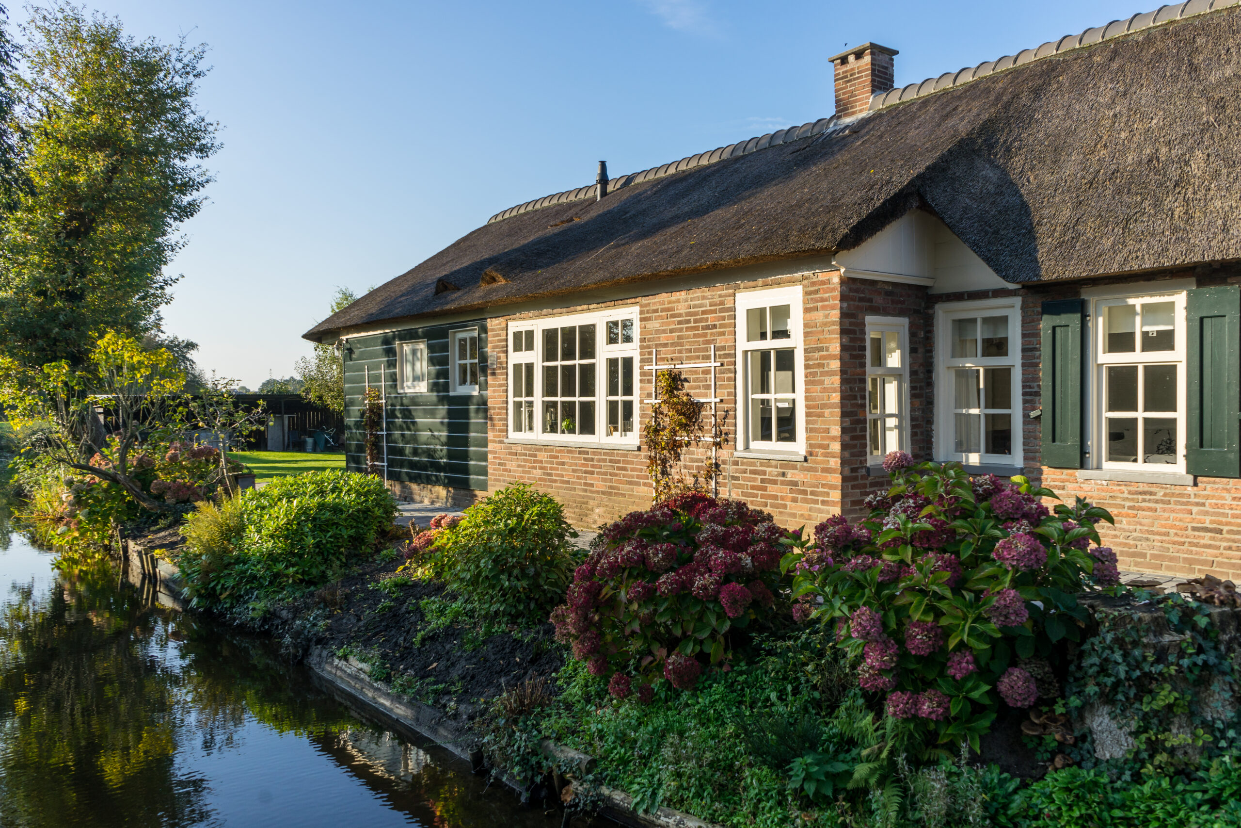 Giethoorn, Netherlands - 5 November 2019: Traditional dutch houses in Giethoorn village, Netherlands
